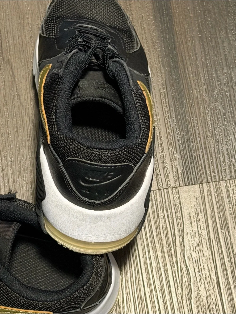 Nike Kids Black Sneakers with Gold Swoosh